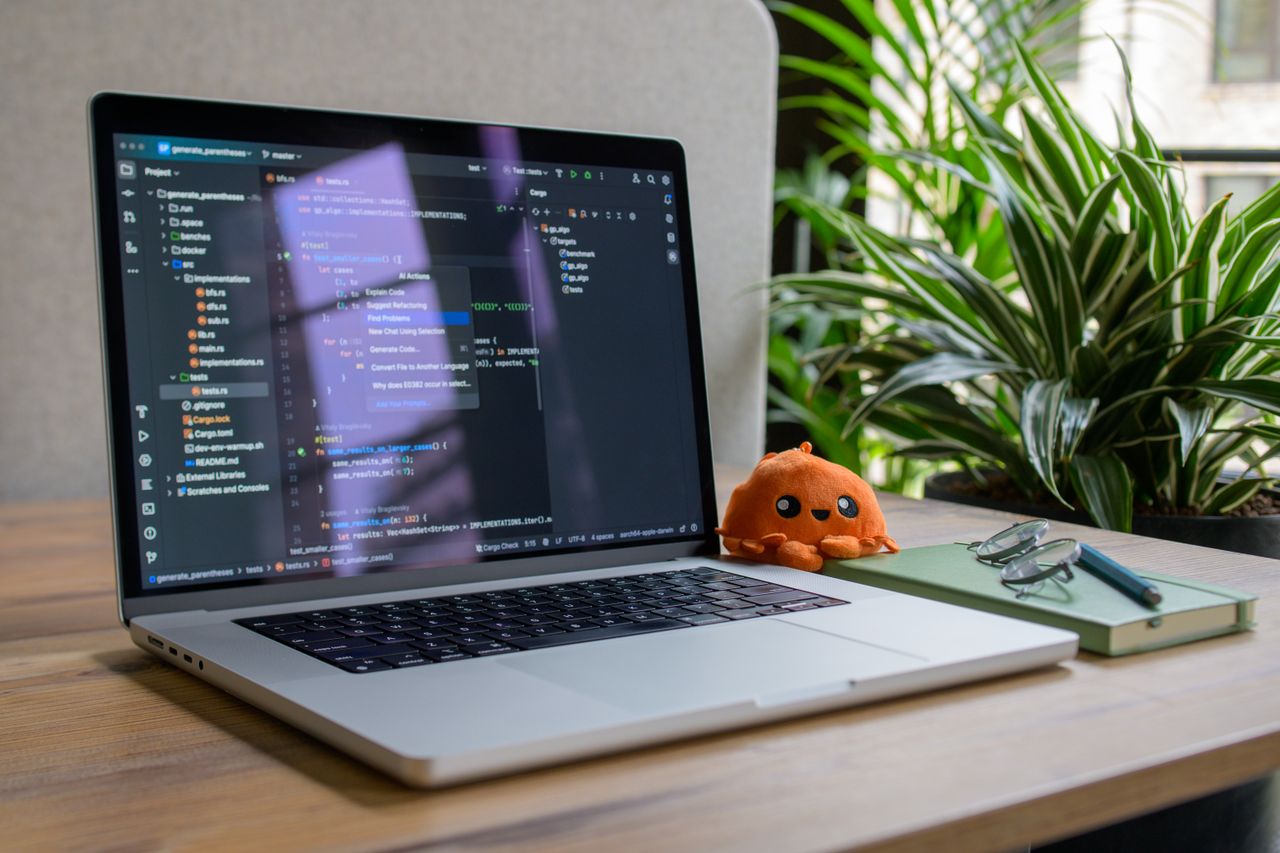 A laptop with a terminal window open on a desk