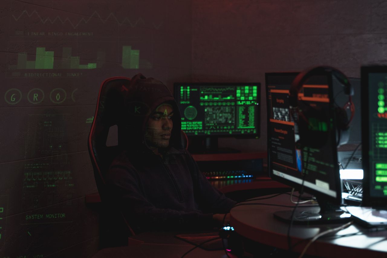 A security analyst watching a screen of alerts